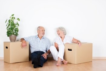 older-couple-in-new-home-with-moving-boxes.jpeg